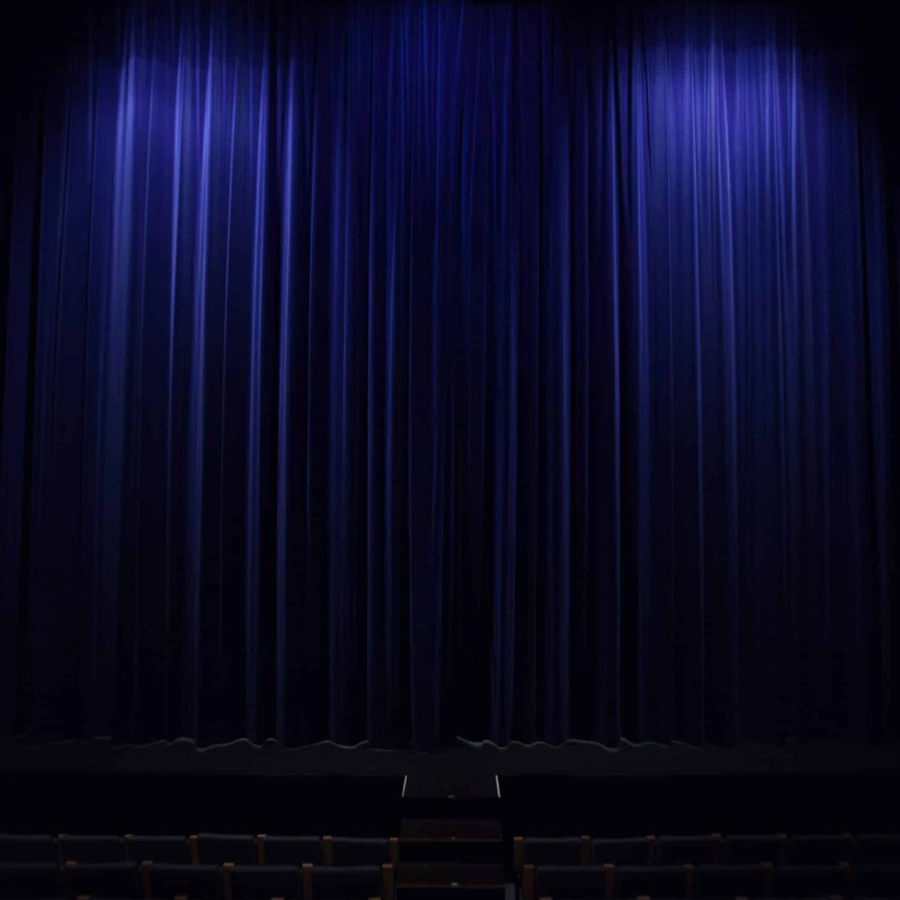 closed-empty-theater-with-blue-curtains-2026-03-17-04-08-38-utc